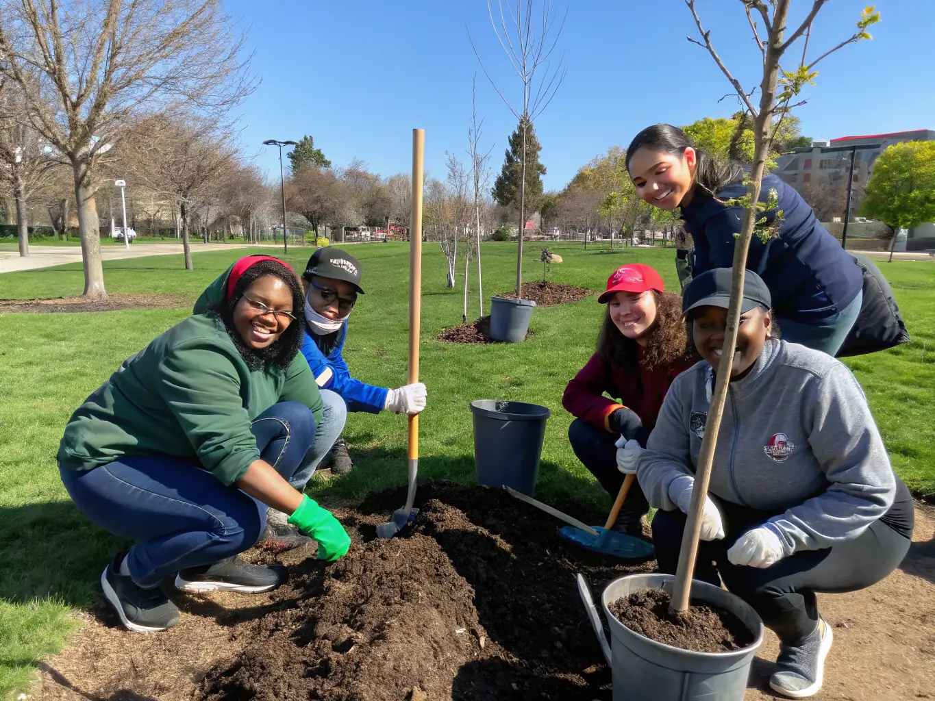 Volunteers planting trees in a local park, symbolizing LINE UP 14's commitment to community betterment and environmental stewardship.
